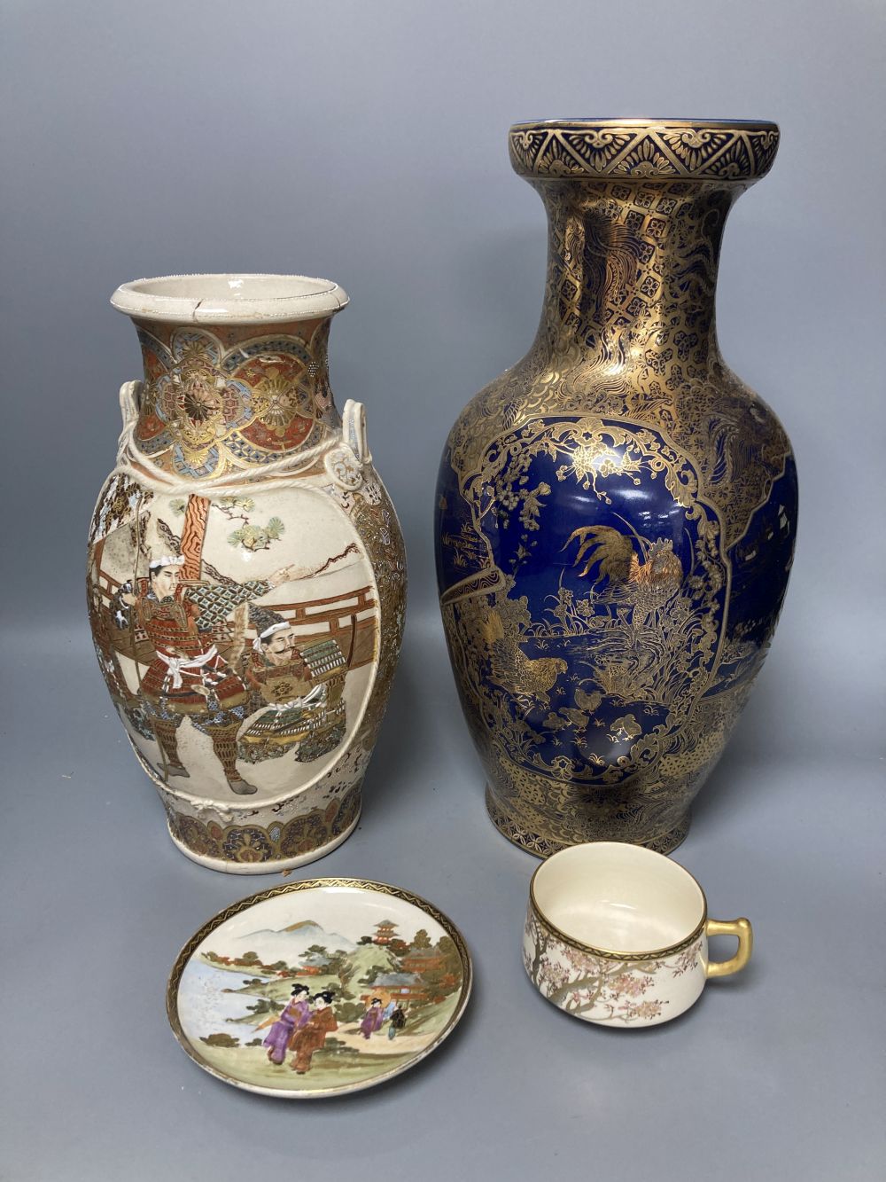 A Japanese satsuma vase, a tea cup and saucer and another vase, tallest 37cm